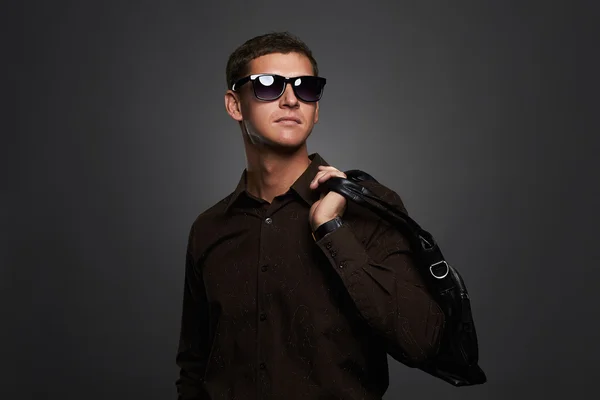 Young man with a handbag — Stock Photo, Image