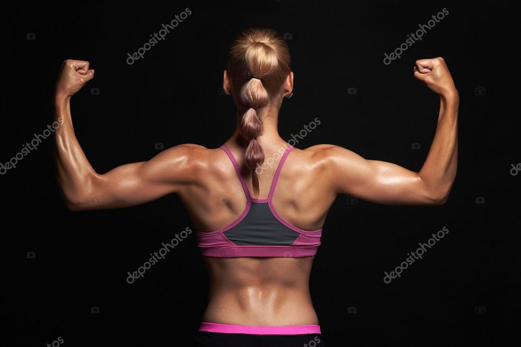 Back of athletic girl. gym concept. muscular fitness woman, trained female  body.healthy lifestyle Stock Photo by ©EugenePartyzan 118451486