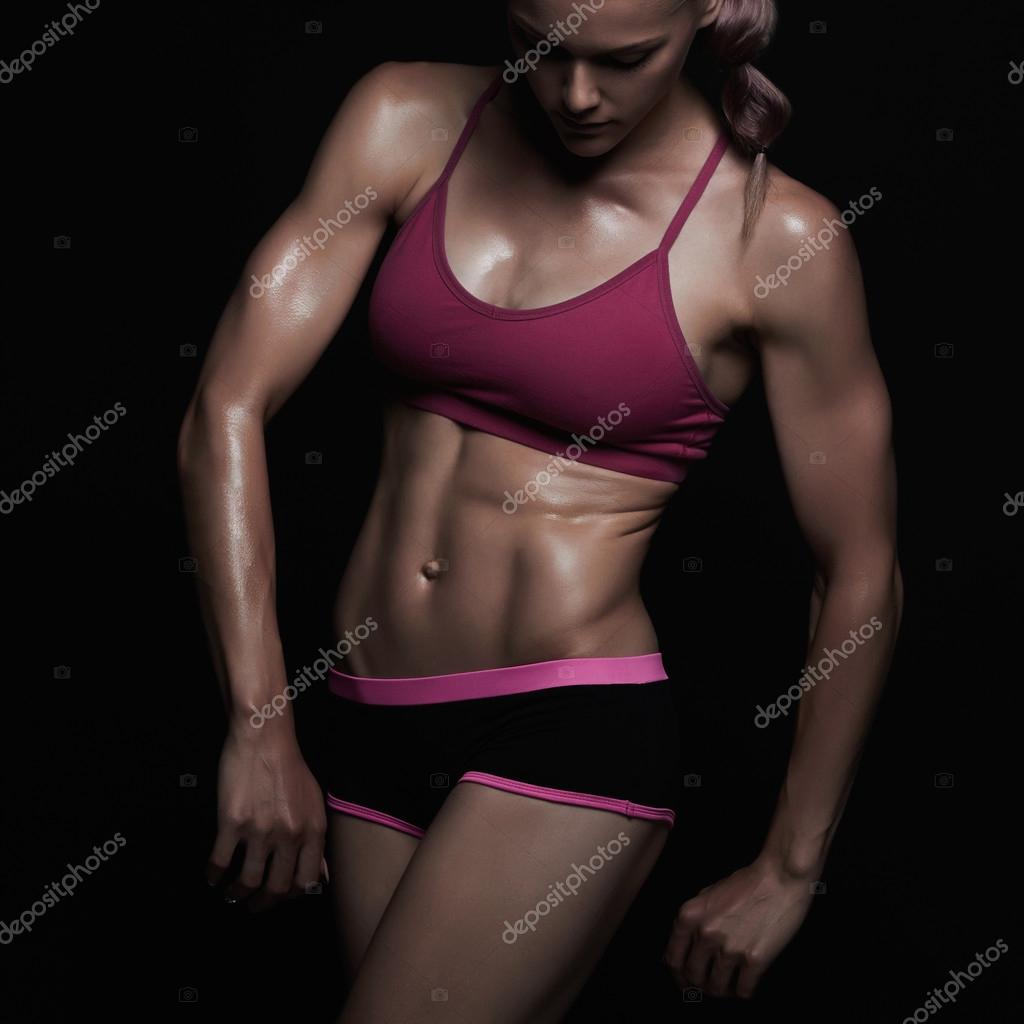 Athletic girl.muscular fitness woman, trained female body.healthy  lifestyle.bodybuilding Stock Photo by ©EugenePartyzan 118451520