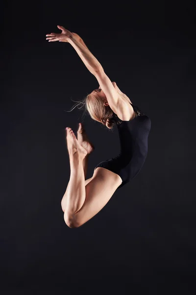 Jumping beautiful gymnast girl — Stock Photo, Image