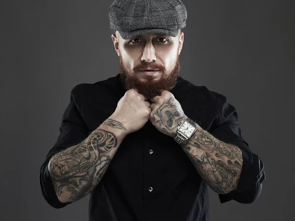 Bearded man with tattoo.old Hipster boy.brutal handsome man in hat — Stock Photo, Image