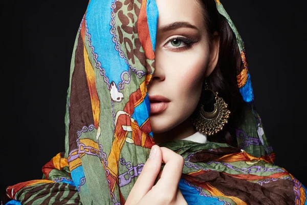closeup portrait of beautiful young woman in color veil. fashion oriental style girl in colorful hijab