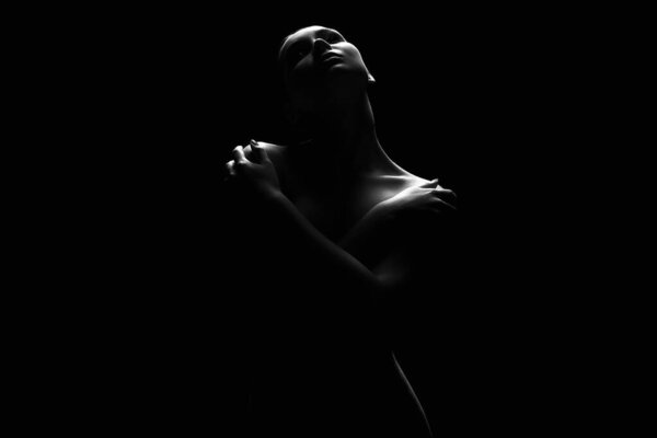 Nude Woman silhouette under light in the dark. Beautiful Sexy Naked Body Girl