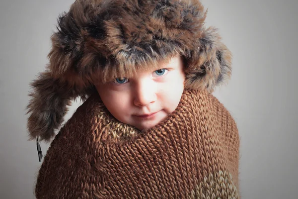 Frozen child in fur Hat.fashion winter style.little boy.children.cold — Stock Photo, Image