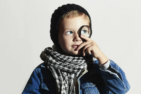 Funny child learns the world.fashionable little boy in scarf and jeans.winter style.fashion kids — Stock Photo, Image