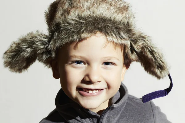 Smiling child in fur Hat.Kids casual winter style.fashion little funny boy.children emotion.hat ear flaps — Stock Photo, Image
