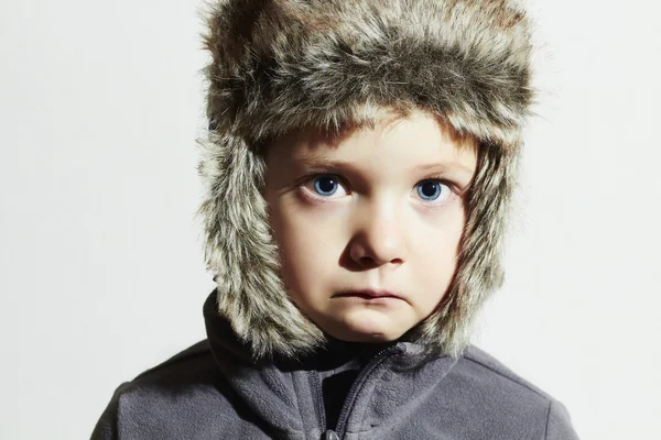Sad child in fur Hat.Kids casual winter style.close-up funny portrait of little boy.children emotion — Stock Photo, Image
