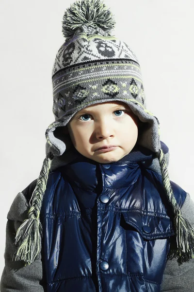 Sad child.winter fashion kids.fashionable little boy in cap — Stock Photo, Image
