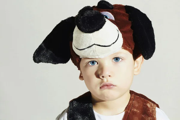 Sad little Boy in Carnival Dog Costume.Kids.Masquerade.Unusual Uniform.Child.Halloween