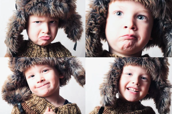 Niño sonriente en piel Hat.Kids invierno style.fashion poco divertido boy.children emotion.hat orejeras. Rostros de niño.Emoción —  Fotos de Stock