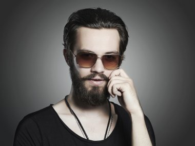 handsome man. Brutal bearded Sexy boy in trendy sunglasses