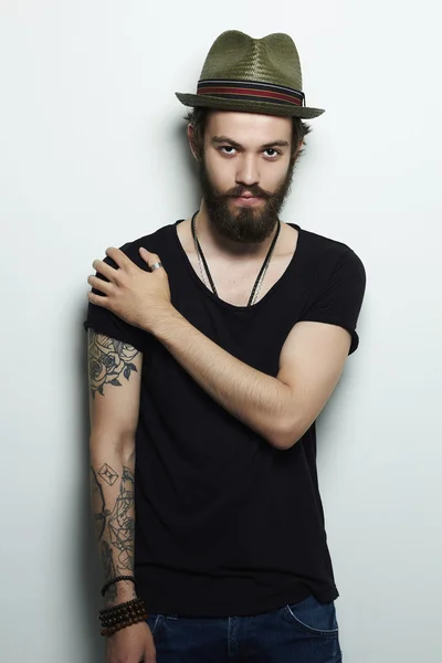 Handsome man in hat.Brutal bearded boy with tattoo — Stock Photo, Image
