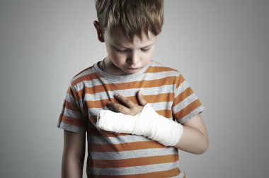 little boy in a cast.child with a broken arm.kid after accident clipart