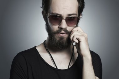 handsome man. Brutal bearded Sexy boy in trendy sunglasses