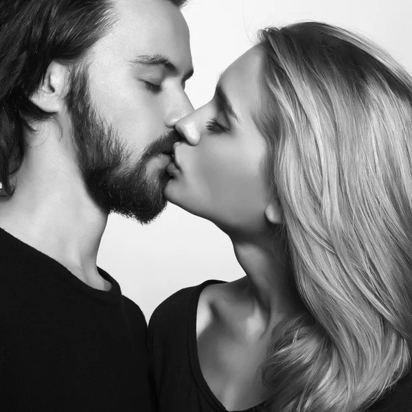 Kissing couple.romantic beautiful woman and handsome man.monochrome portrait of lovely boy and girl