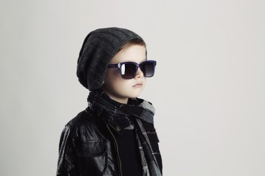Funny child in scarf and hat.fashionable little boy in sunglasses
