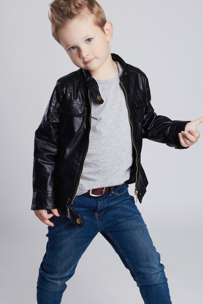 Fashionable child in leather coat.little boy. Autumn fashion.funny kid