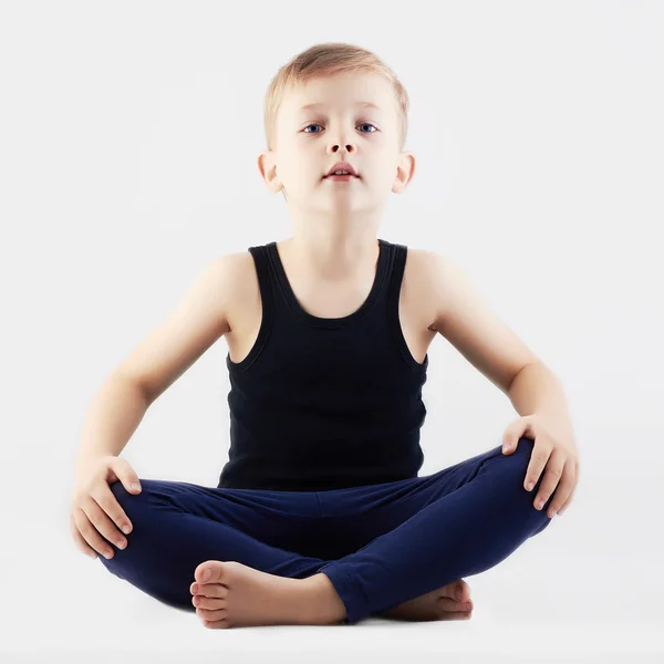 Little Boy does yoga — Stock Photo, Image