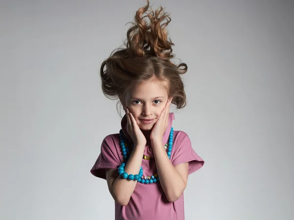 Beautiful little girl with healthy hair.pretty little lady in dress and accessories — Stock Photo, Image