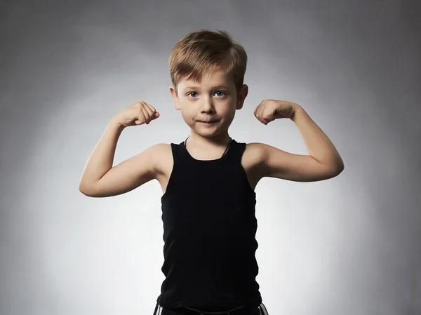 Child. Funny Little Boy.Sport Handsome Boy.bodybuilder showing his hand biceps muscles — Stock Photo, Image