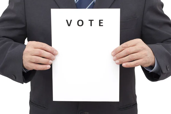 Homem, segurando uma folha com o título VOTE — Fotografia de Stock