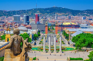 Cityscape of Barcelona with aerial view of Placa d'Espanya or Spain square with Torres Venecianes Venetian towers, Montju c fountain and Four Columns Les Quatre Columnes, Tibidabo hill background clipart