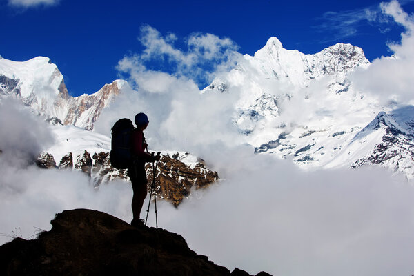 Hiker on the trek in Himalayas, Annapurna valley, Nepal