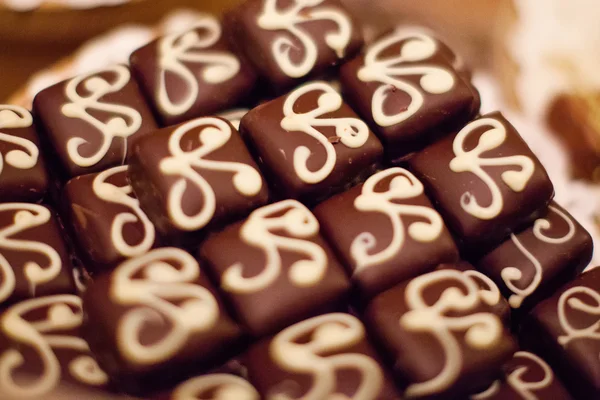 Närbild brun choklad godis bakgrund — Stockfoto