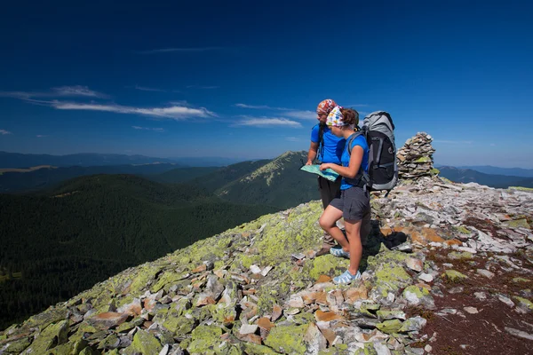 Portrait of couple at the top of the mountain that search for th