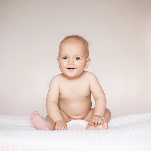 Cute baby boy against white background Stock Image