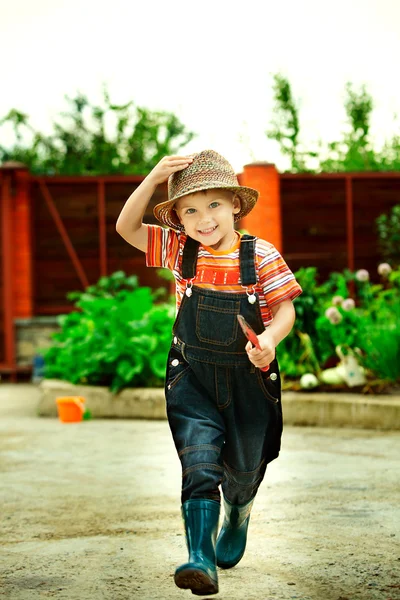 Portrait of a boy worked in the garden in holiday — Stok Foto