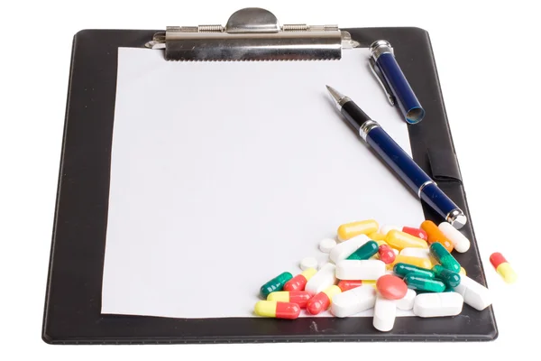 Pills and notepad — Stock Photo, Image