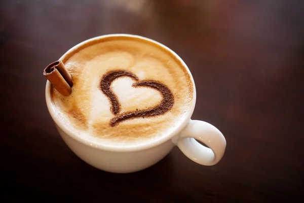 Coffee cup with milk and heart shape Stock Photo