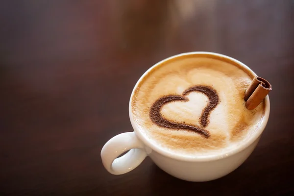 Coffee cup with milk and heart shape Royalty Free Stock Photos