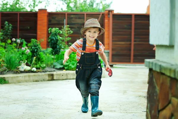 Portrait of a boy worked in the garden in holiday — Stok Foto