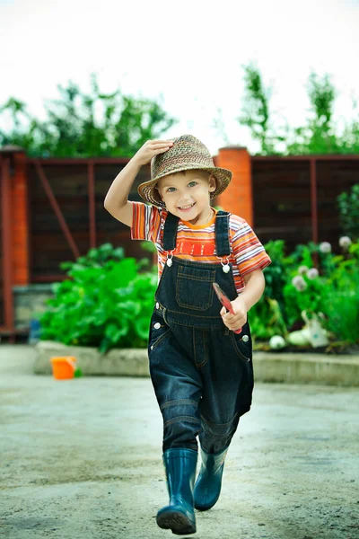 Portrait of a boy worked in the garden in holiday — Stok Foto