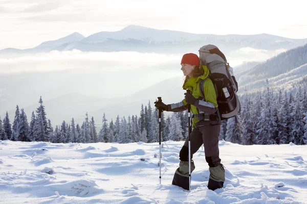 Hiker walking in winter Carpathian mountains — Stock Photo, Image