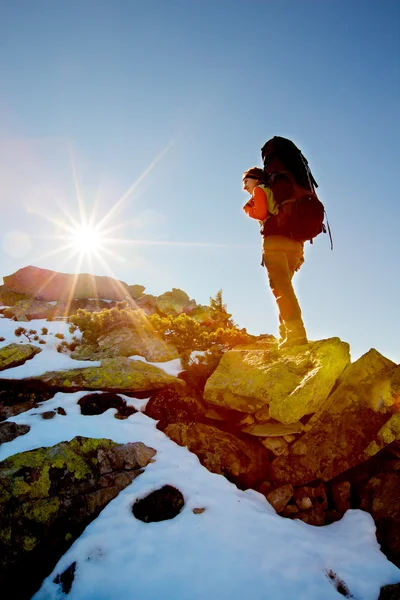 Hiker walking in autumn mountains — Stock Photo, Image