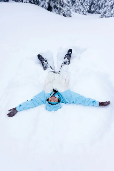 Portrait of the hiker lying in snow — Stock Photo, Image