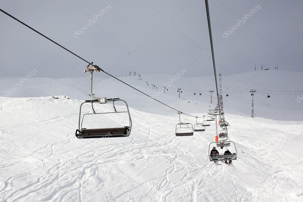 Skiers and snowboarders in the lift at the Gudauri snow resort i