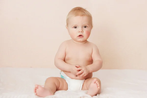 Caucasian baby boy joyfully smiles at camera — Stock Photo, Image