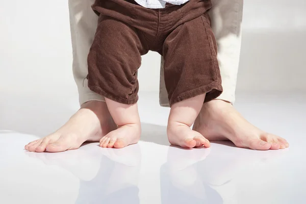 Baby's first steps Stock Image