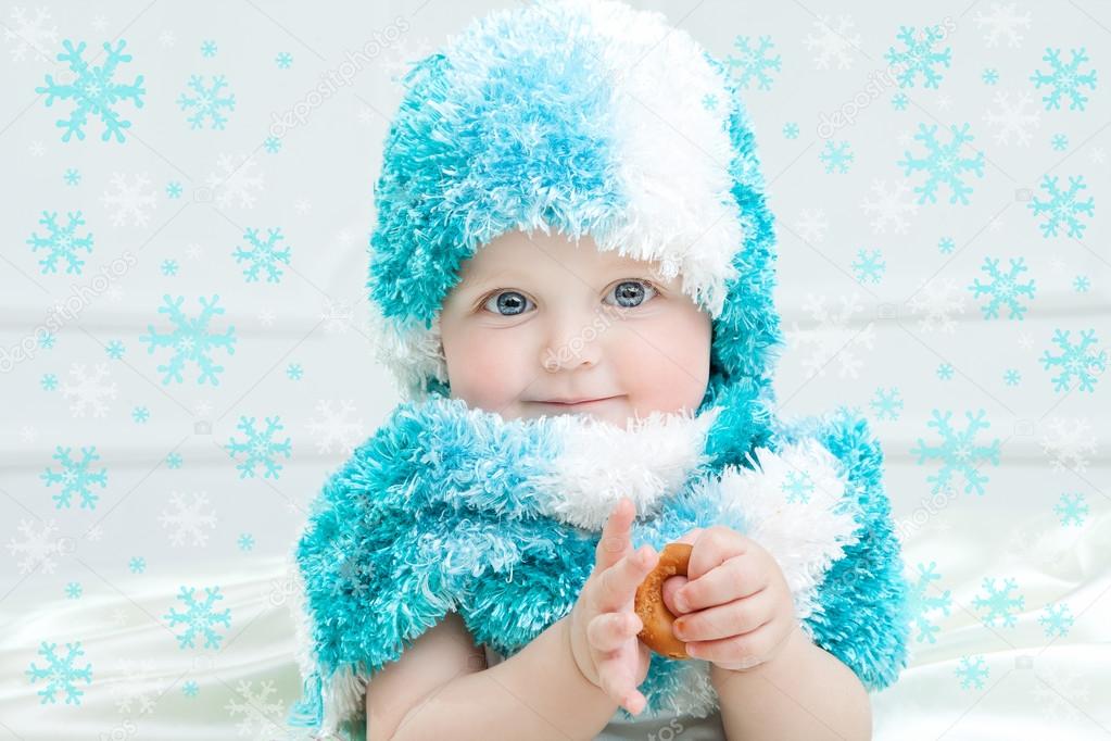 Cute baby at winter background — Stock Photo © MyGoodImages 88562206