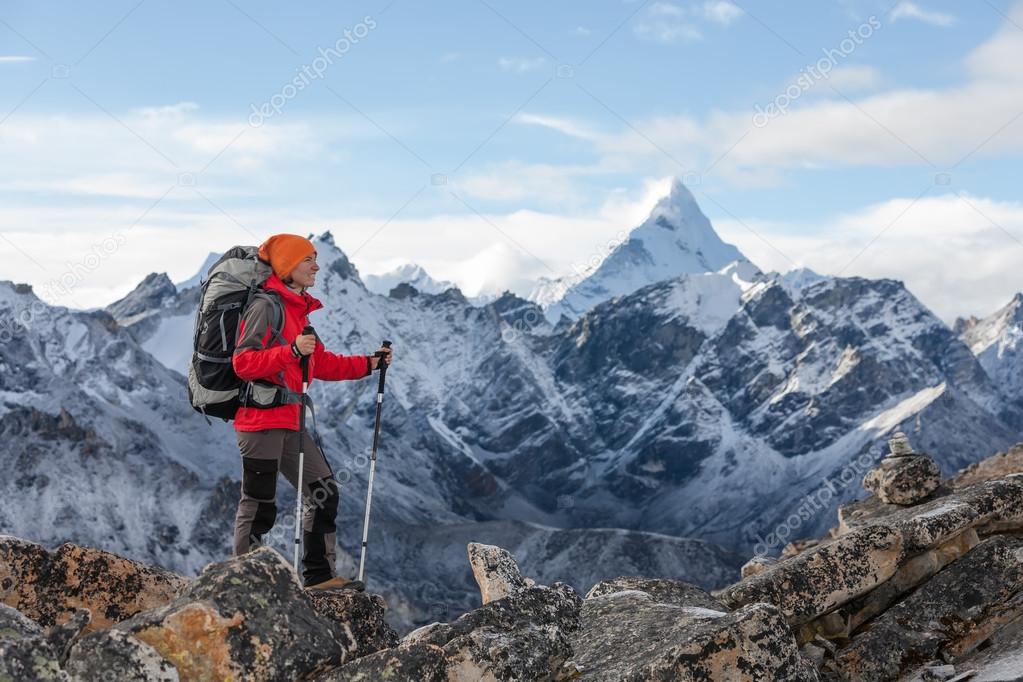 Hiker walks on train in Himalayas