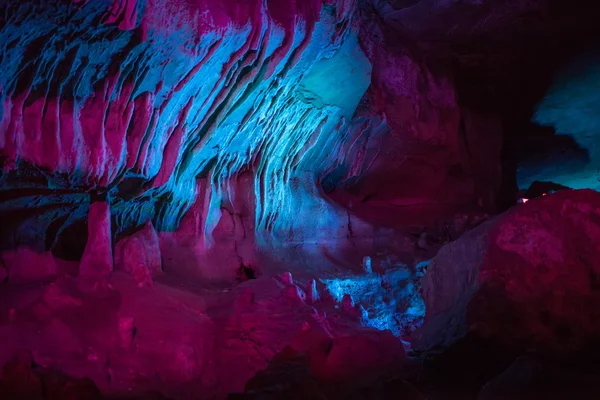 Sataplia cave in Georgia lit by different colors — Stock Photo, Image