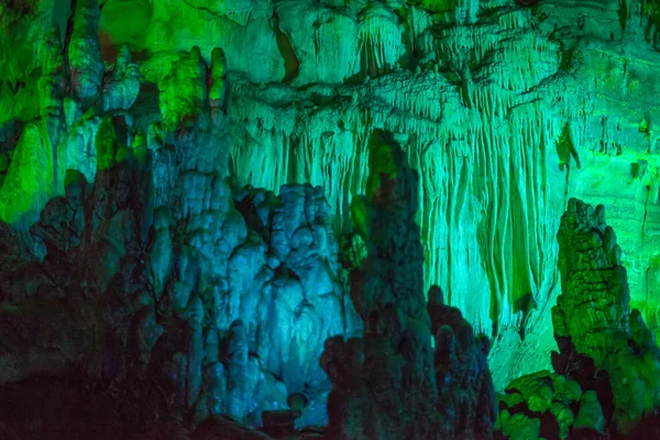 Sataplia cave in Georgia lit by different colors — Stock Photo, Image
