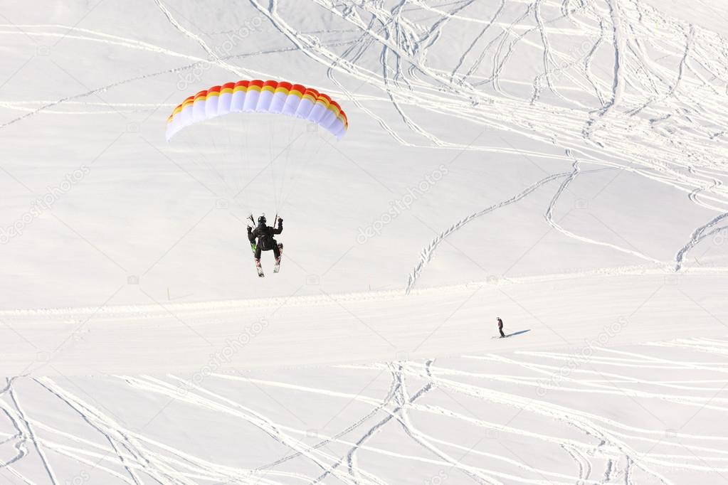 Paraglider in winter Caucasus mountains in Georgia