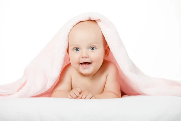 Caucasian baby boy covered with green towel joyfully smiles — Stock Photo, Image