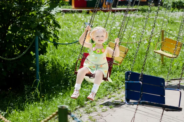 Girls are having fun at merry-go-round — Stock Photo, Image