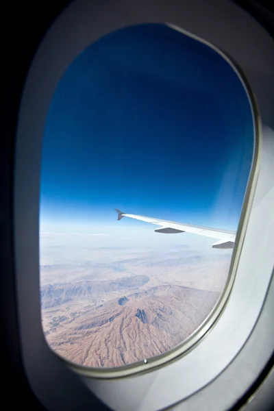 View at the earth from window of airplane